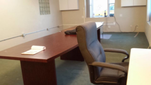 An office space undergoing renovation with exposed conduit and unfinished flooring by DCI in St. Louis, MO