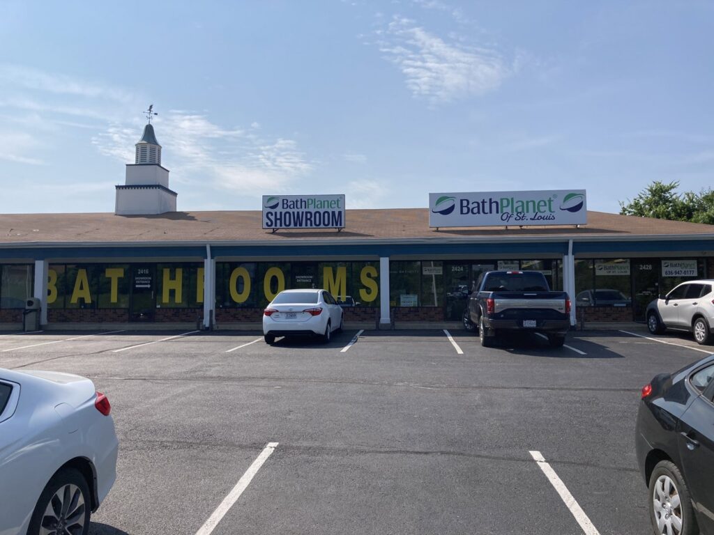 An old bathroom with a tub, shower, and grab bar, representing a potential renovation project for Bath Planet of STL & More in Saint Charles, MO.