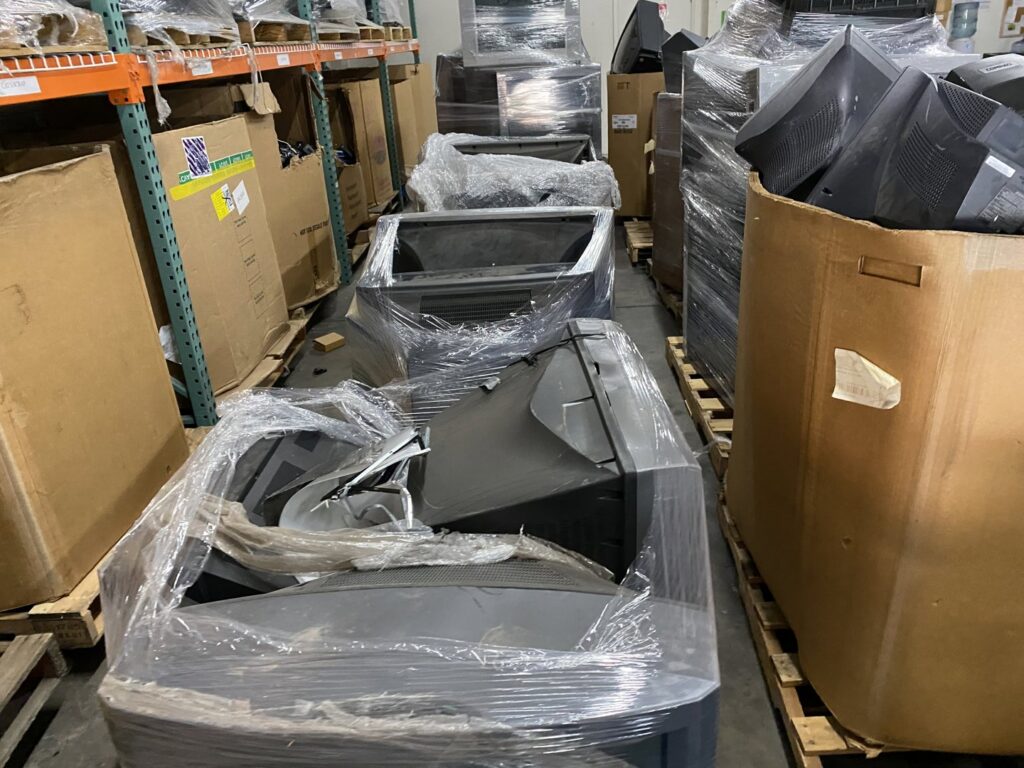 Old CRT monitors and other e-waste wrapped on pallets in the R3Ewaste facility in Phoenix, AZ