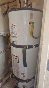 An old water heater being inspected or prepared for replacement by Medina's Handyman LLC in Las Vegas, NV