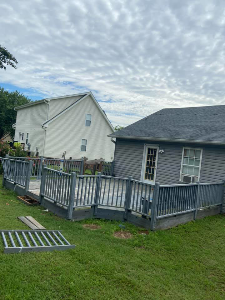 An old, weathered wooden deck before renovation by LDT Construction Services in Spring Hill, FL.