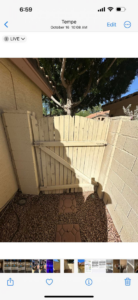 An old, weathered wooden gate in need of repair or replacement by Basevi Home Repair LLC in Gilbert, AZ