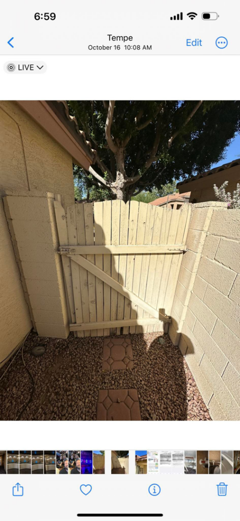 An old, weathered wooden gate in need of repair or replacement by Basevi Home Repair LLC in Gilbert, AZ