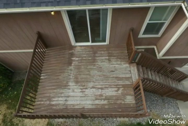 An old, worn wooden deck with peeling finish, indicating a need for repair or replacement services from Ridgeline Decks in Spokane, WA.