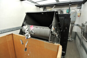 An on-site data destruction machine shredding electronic components inside a Securis truck in Greensboro, NC