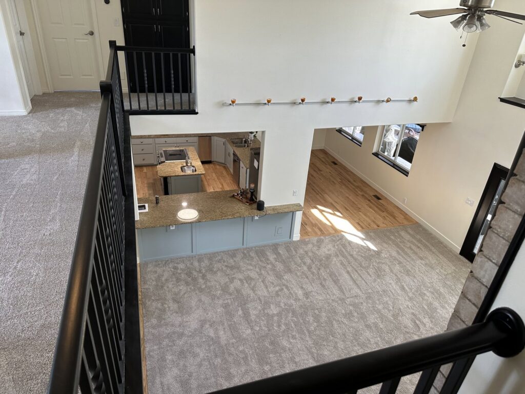 Completed open-concept home remodel with new flooring and kitchen by Handyman house repairs and remodeling in Provo, UT