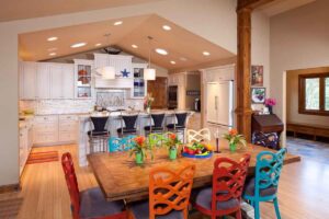 A spacious open-concept kitchen and dining area remodel with white cabinets, by Northrup Remodeling in Minneapolis, MN