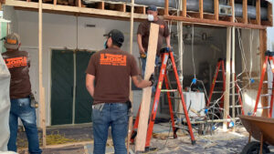 Open concept kitchen and living room renovation with wall removed and new beam by Load Bearing Wall Pros in Plano, TX.