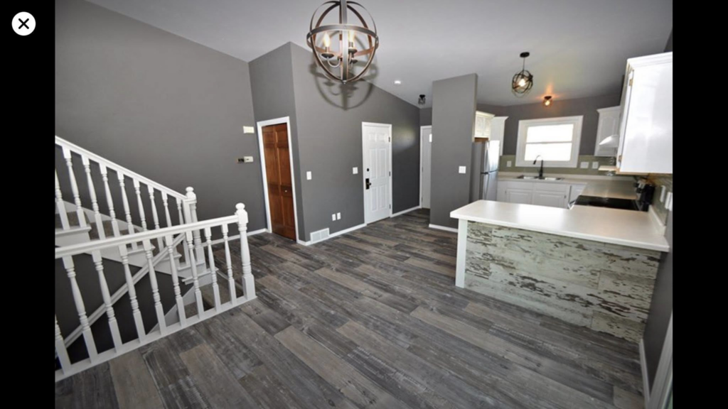 An open-concept living area with new flooring and fresh paint by Fueled Up Flooring- Justin Watruba in Eau Claire, WI.