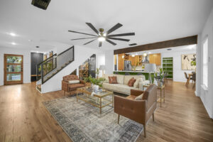 An open-concept living room and kitchen area with modern finishes, completed by HomeNovate in San Antonio, TX.