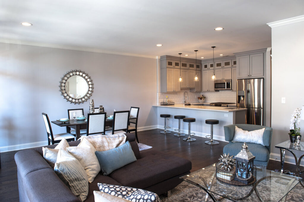 An open concept living room and kitchen with modern finishes by 3F Construction in Chicago, IL.