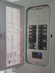 An open electrical panel with labeled circuits for rooms and appliances, installed by MorLite Electric in Newport News, VA.