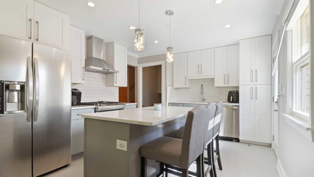 A spacious open-plan office space with cubicles and exposed brick walls, built by ETI Construction in Chicago, IL.