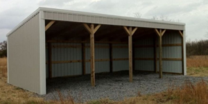 An open-sided metal shed with wooden support beams, built by D.H. Construction in Jackson, TN.