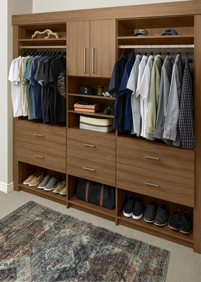An organized custom closet with built-in storage and shelving by Construction Components in Puyallup, WA.