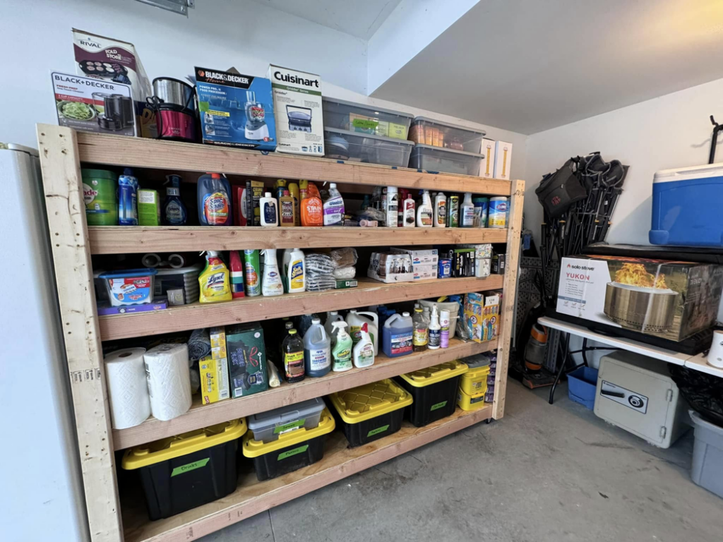 Organized garage shelving unit with cleaning supplies installed by Home Pros WV in Charleston, WV.