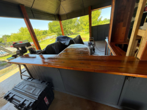 Outdoor bar with a newly finished wooden countertop, showcasing handyman work by Duane Moss Painting in Oklahoma City, OK.