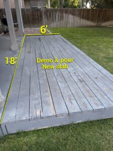 An outdoor wooden deck marked for demolition and new concrete slab pouring by TEXAN Home Improvements LLC in San Antonio, TX.