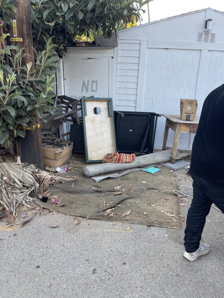 An outdoor pile of various junk items awaiting removal by West LA Hauling in Los Angeles, CA.