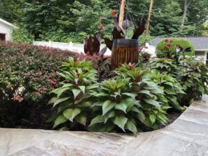 A custom outdoor kitchen with a built-in grill and counter space by Rescue Landscaping and Outdoor Living in St. Louis, MO.