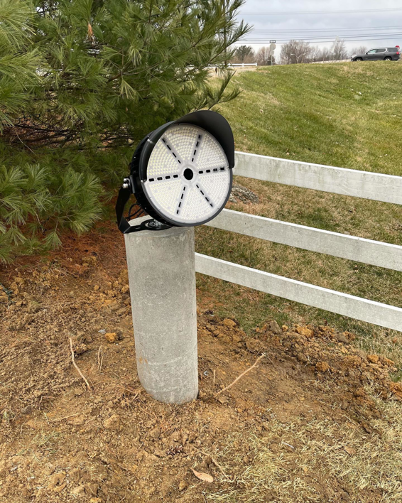 An outdoor LED light fixture installed on a concrete post by Hyland Enterprises in Owensboro, KY.