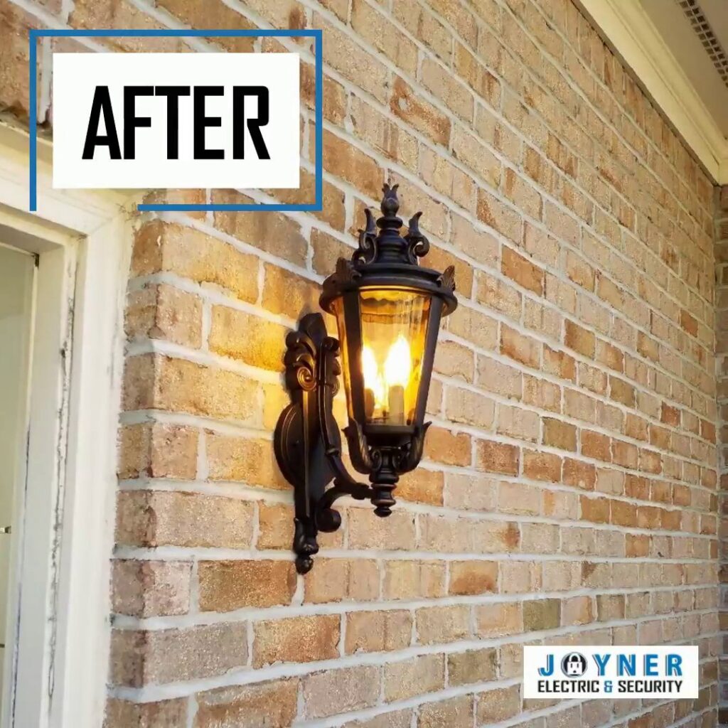 A newly installed outdoor light fixture on a brick wall, showcasing a completed job by Joyner Electric And Security in Savannah, GA.