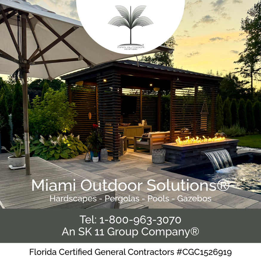 An outdoor living space with a pergola, fire pit, and waterfall feature by SK 11 Group, Inc. in Miami, FL.