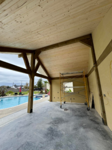 An outdoor covered patio or pool house under construction by Royal Construction & Remodeling, Inc. in Lake Charles, LA.