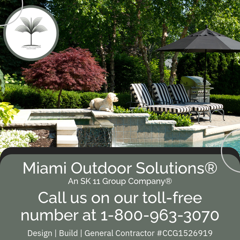 An outdoor patio design and build project with a water feature and lounge chairs by SK 11 Group, Inc. in Miami, FL.
