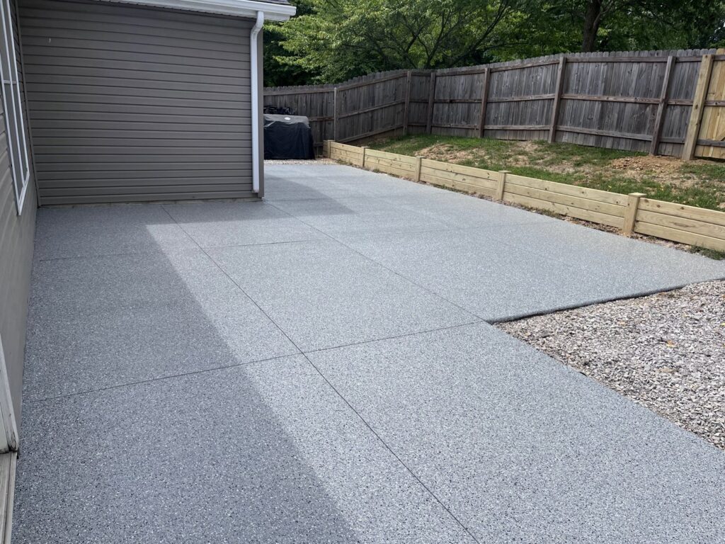 A newly coated outdoor patio and driveway, enhancing curb appeal by Egli Coating Solutions handyman in Evansville, IN.