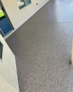 A durable and attractive speckled flake coating applied to an outdoor patio by Savage Coatings in Lakeland, FL.