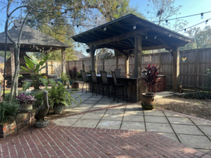 An outdoor patio with a newly constructed gazebo and bar area by Ourso Renovations in Baton Rouge, LA