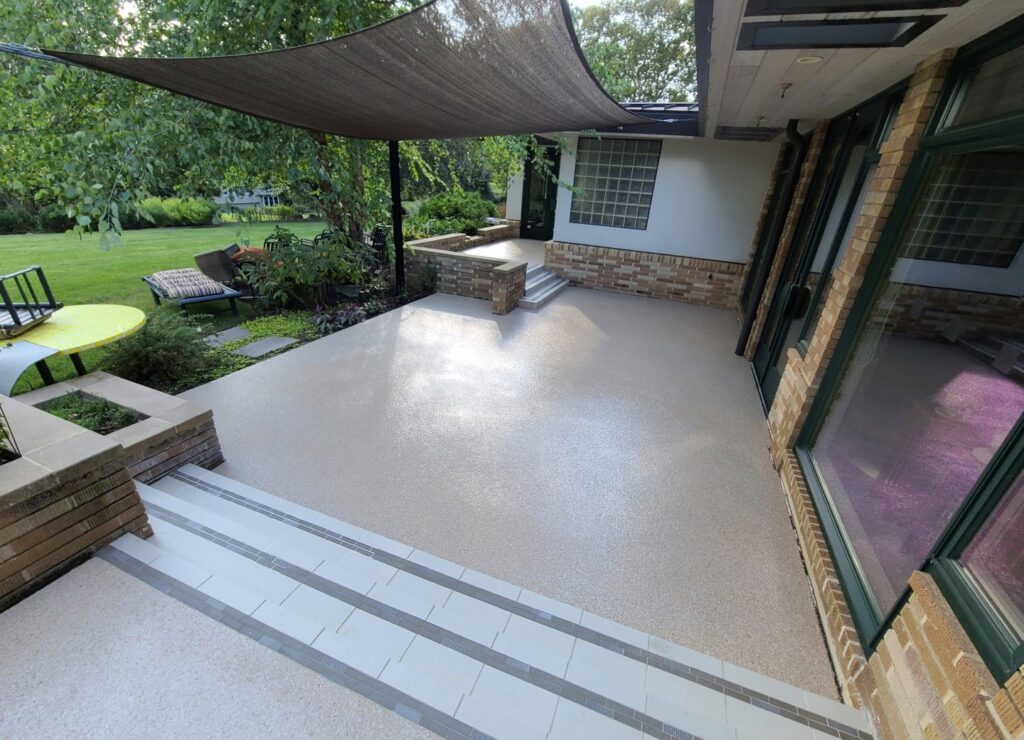 An outdoor patio and living space renovation with a new epoxy surface by Roche Epoxy Floors in Allentown, PA.