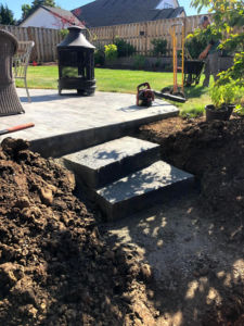 Installation of outdoor patio steps with excavated dirt by Big Rock Construction Llc in Gresham, OR