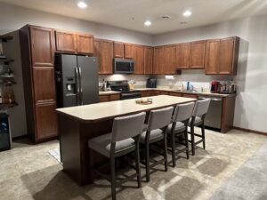 A worker installing decorative tiles on an outdoor patio by CSR Tile Construction LLC in Minneapolis, MN.
