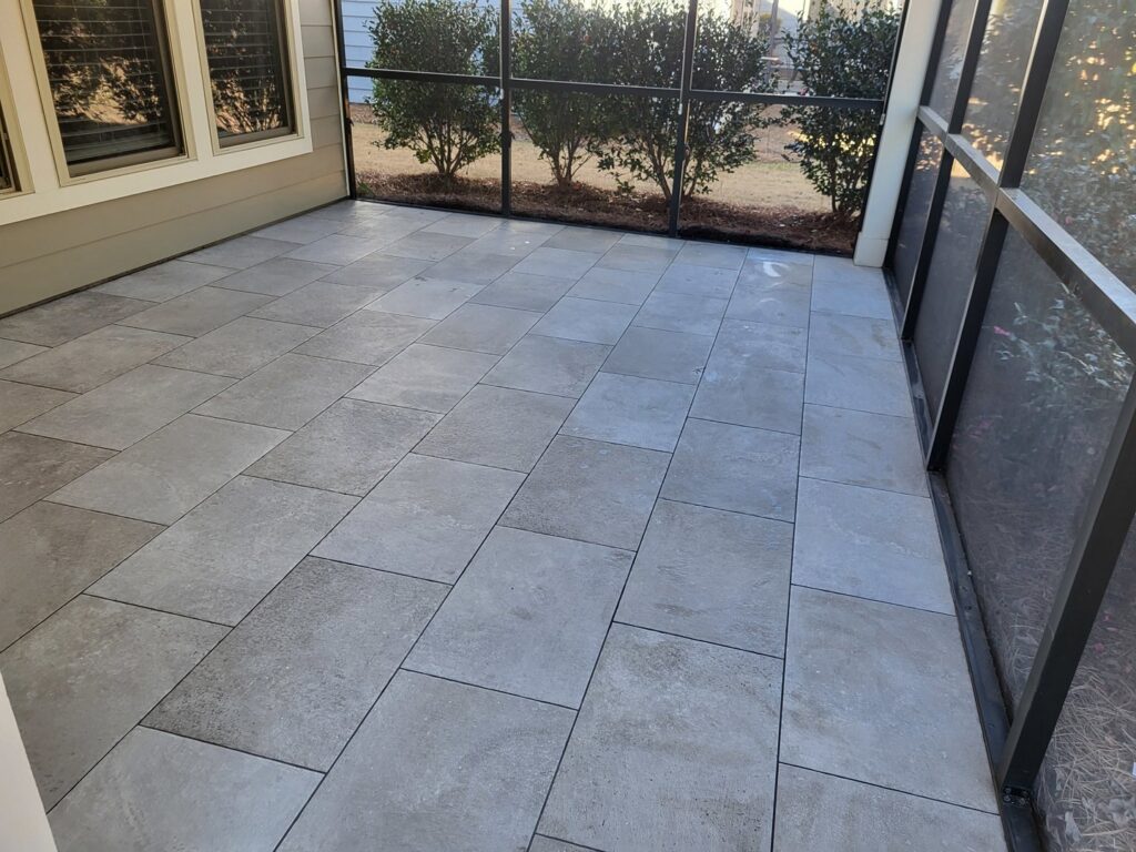 Outdoor patio tile installation completed by Gladiator Flooring LLC, a handyman service in Summerville, SC.