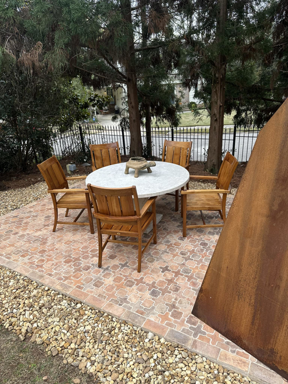 An outdoor patio with new tile flooring installed by Parker Painting Company in Edmond, OK.