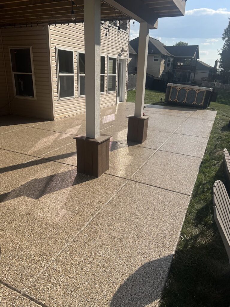 A sunny outdoor patio with a durable flake epoxy coating installed by Donnelly J. LLC Epoxy in St. Charles, MO.
