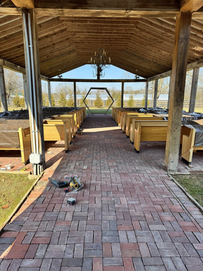 Power tools on a brick path during outdoor pavilion construction by Landsaw Craftsman & Co. in Richmond, KY.