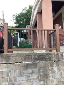 A newly installed outdoor railing on a concrete wall by Mr. Handyman of Northern Pittsburgh, PA.