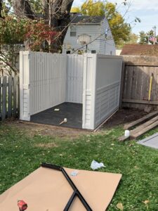 Outdoor storage shed assembly and construction in progress by Segovia LLC interiors in Madison, WI.