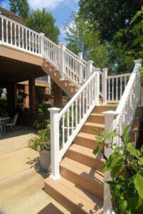 Newly built outdoor stairs and railing leading to a deck or patio by Rothrock Renovation & Remodeling in Winston-Salem, NC
