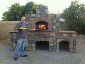 A newly constructed outdoor stone and brick pizza oven built by Ken's Masonry, LLC in Chandler, AZ.