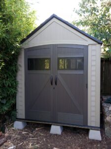 A newly assembled outdoor storage shed with double doors by Barry's Handyman Service, serving San Diego, CA.