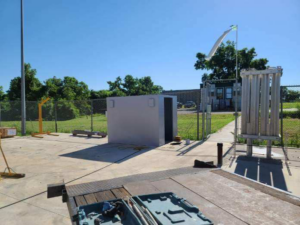 An outdoor storm shelter installed in an open area, ready for use, by Taylor Storm Shelters in Stillwater, OK.