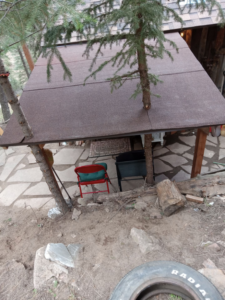 An outdoor structure with a flat roof under repair or construction by Platinum Contractors LLC in Greenwood Village, CO.