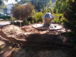 Outdoor trenching and concrete pad preparation for a project by Shane's Handyman Service in Edmond, OK.