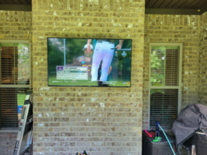 Professional outdoor TV mounting service on a brick wall by Tvbypass in Jackson, TN.