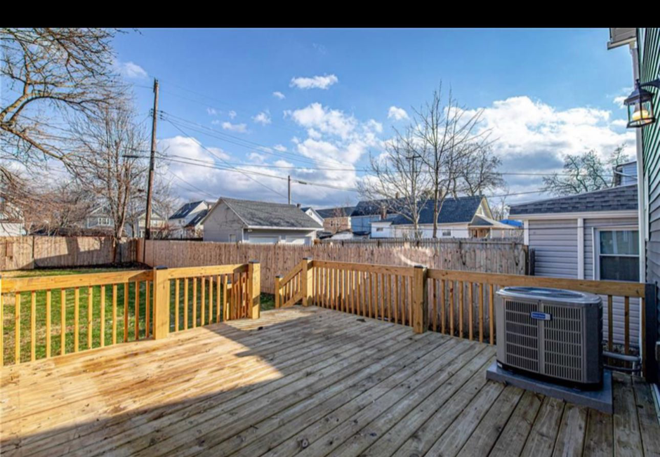 A newly constructed or renovated outdoor wooden deck with sturdy railings by JC Remodeling Ro LLC in Cleveland, OH.