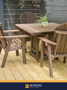A newly constructed wooden deck with outdoor patio furniture and a slatted fence by JDM Outdoors of Robinson in Pittsburgh, PA.